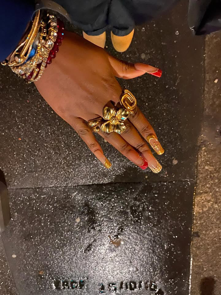 a hand with some rings at their fingers